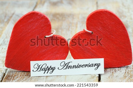 Happy Anniversary card with two red wooden hearts