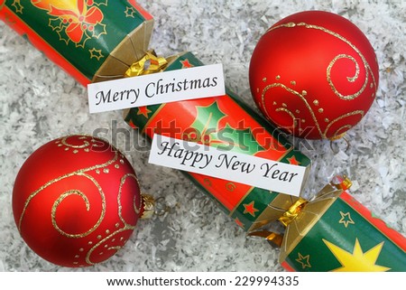 Merry Christmas and Happy New Year cards with red baubles and Christmas cracker