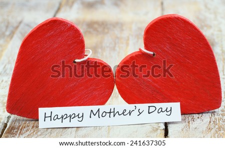 Happy Mother\'s day card with two red wooden hearts