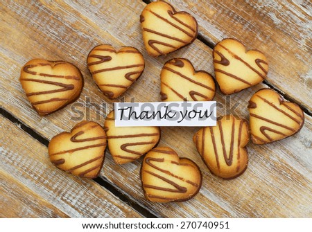 Thank you card with heart shaped cookies on rustic wood