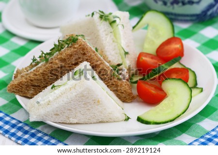 Cream cheese and cucumber sandwiches with green salad
