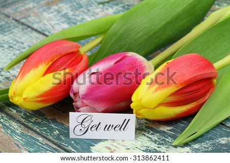 Get well card with colorful tulips on rustic wooden surface