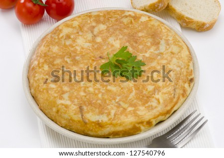 Spanish Cuisine. Spanish Omelette in white background. Tortilla de patatas.