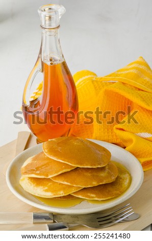 Agave syrup and pancakes.. Alternative sweetener to sugar. Selective focus. White background.