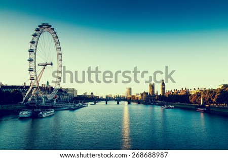 LONDON, UK - October 05, 2014: Retro Photo Filter Effect  - London Skyline landscape at Sunrise with Big Ben, Palace of Westminster, London Eye, Westminster Bridge, River Thames, London, England, UK.