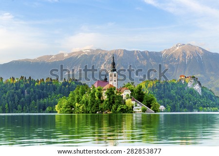 Church on Island in Lake Bled, Slovenia, with Castle in distance