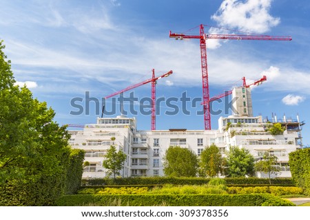 LONDON - August 15 : Construction Tower Cranes dominating a London Suburb skyline, England, UK. London August 15 2015.