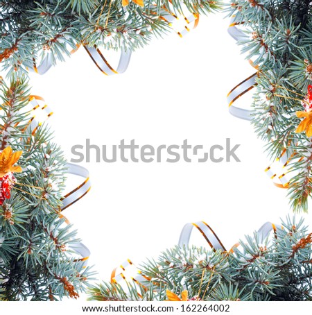 Christmas tree branch with gold serpentine and star on white background isolated