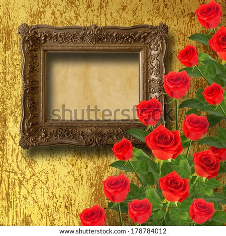Vintage wooden frame with red rose and green leaves on the gold abstract background