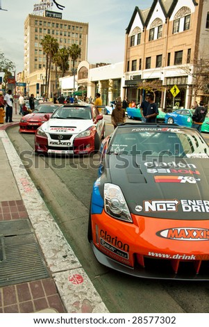 LONG BEACH, CA - APRIL 9: Cars from the formula drift event perform a parade to Pine Street to meet and greet with fans and pilots April 9, 2009 in Long Beach, California.