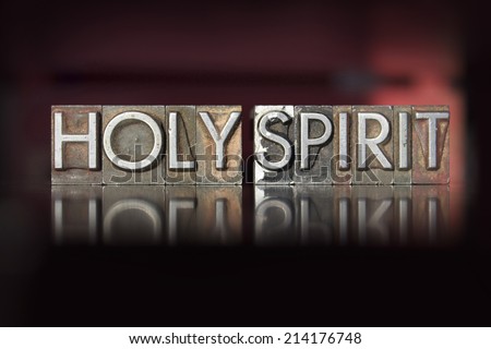 The words Holy Spirit written in vintage letterpress type
