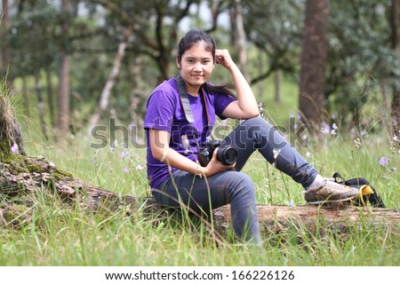 happy girl act in pine forest northeast of thailand