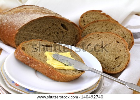Fresh baked baguette sliced into pieces and ready to serve