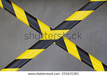 Black and Yellow Barrier Tape Blocking the Way