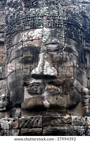 Statue Face at the temple of Angkor Wat in Cambodia