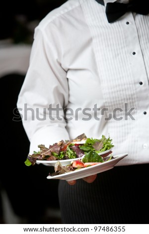 Food being served by a waiter during a catered event