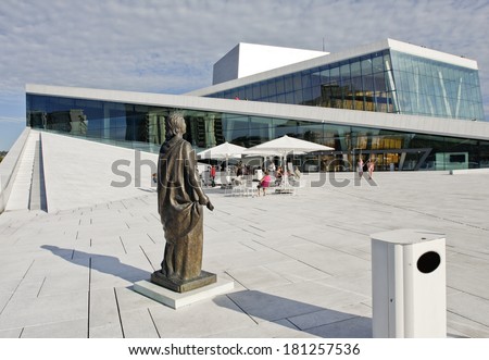 OSLO, NORWAY Ã¢Â?Â? JULY 09. The Opera House in Oslo City on July 09, 2010 in Oslo, Norway. Unidentified people in the area, on the roof. Glass and marble! Statue this side.