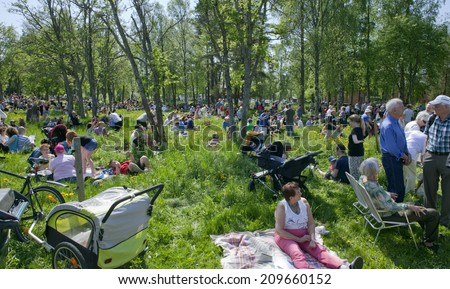 UMEA, SWEDEN ON JUNE 06. People celebrating the Swedish National Day on June 06, 2014 in Umea, Sweden. Unidentified people in a park next to Gamlia Homestead.