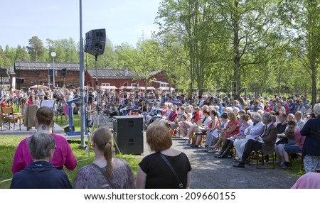 UMEA, SWEDEN ON JUNE 06. People celebrating the Swedish National Day on June 06, 2014 in Umea, Sweden. Unidentified people in Gamlia Homestead.