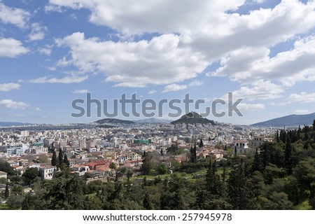 ATHENS, GREECE ON APRIL 14. Skyline of the City of Athens from a hill, slope on April 14, 2011 in Athens, Greece. View from the walkway up to Acropolis.