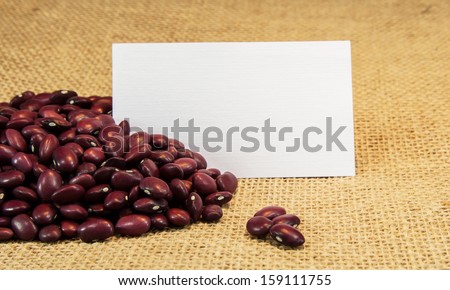 red beans on burlap with note card