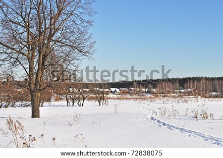 Outskirts of russian village in winter time on sunny day
