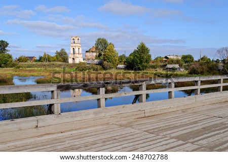 North Russian village Pesok and old wooden bridge over the river Ukhta