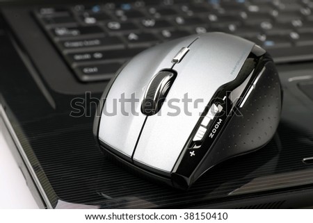 wireless mouse on a laptop on a white background