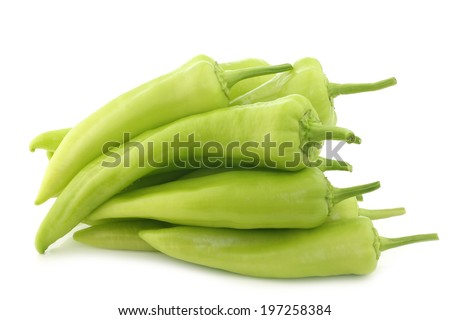 fresh green sweet peppers (banana peppers) on a white background