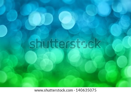 Artistic bokeh background. Soft defocused blue and green lights