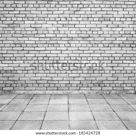 Room interior with white brick wall and tiled floor