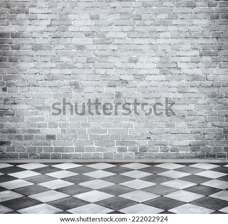 Grunge room with brick wall and tiled floor