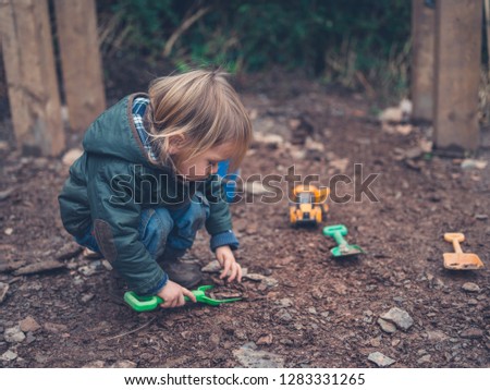 Image, Stock Photo Child playing with rocks and sand