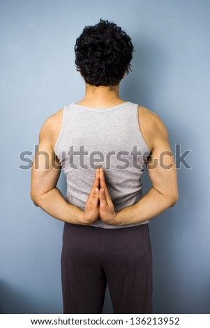 Young mixed race man in yoga pose