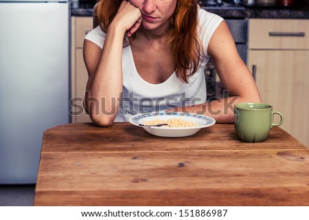 Woman does not want to eat her cereal