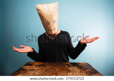 Confused man with bag over head