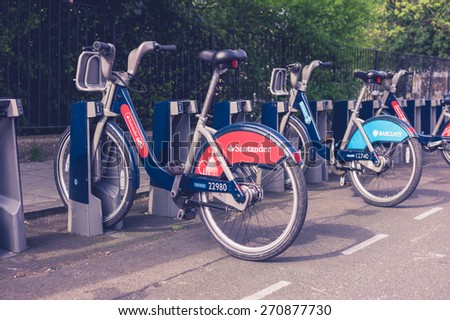 London, United Kingdom - April 16, 2015: Docking station for TFL bicycles sponsored by Barclays and Santander in London during the spring of 2015