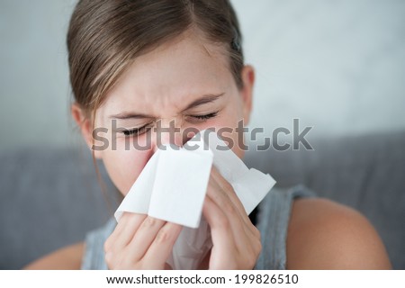 Cold flu illness of child - tissue blowing runny nose