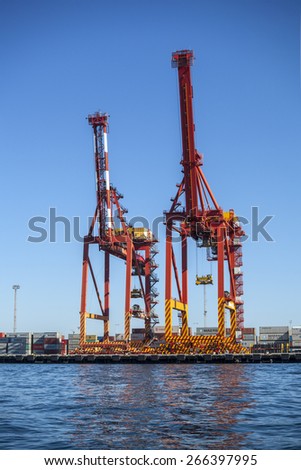 FREMANTLE, AUSTRALIA, 29 MARCH, 2015: Two Post-Panamax cranes in the Fremantle Inner Harbour. The cranes were manufactured in Shanghai and delivered fully assembled to Fremantle, Melbourne and Sydney.