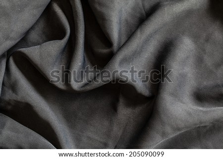 black cloth with wrinkles background.
