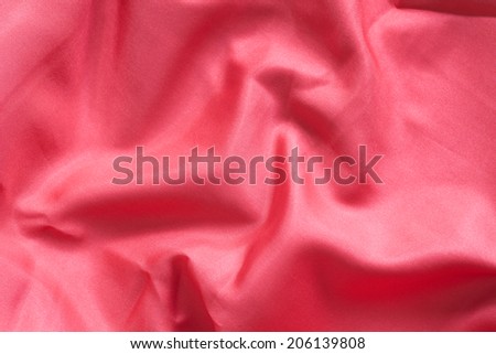 red wrinkled cloth background.