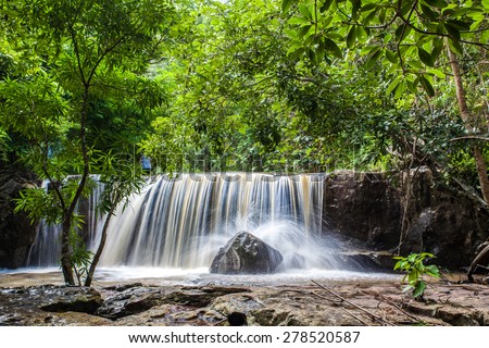 A small waterfall in a tropical forest, Thailand.