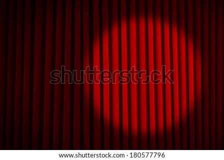 Red Velvet Stage Curtains with Round Spotlight.