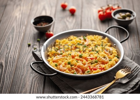 Similar – Image, Stock Photo Pan with rice and beans decorated with chopped green chilies and served on a wooden table