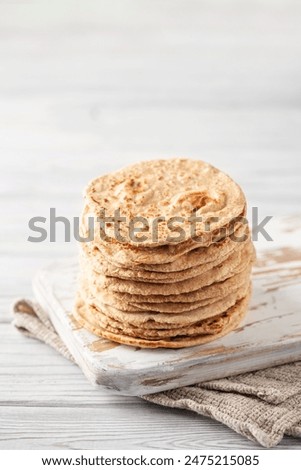 Similar – Image, Stock Photo Indian flatbreads on a blue background, above view. Homemade naan bread