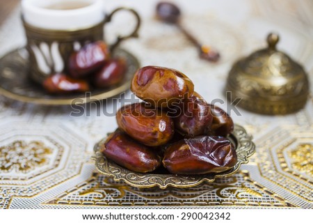 dates on a plate on a table, selective focus, east style
