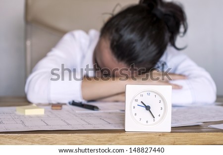 Corporate worker sleeping at the office