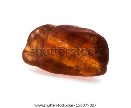 Closeup picture of uncut red garnet gemstone isolated on white background.