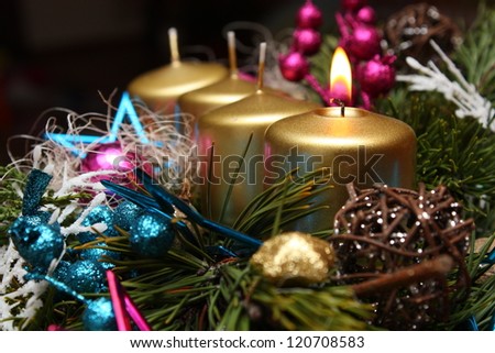 Christmass advent candle with green twig