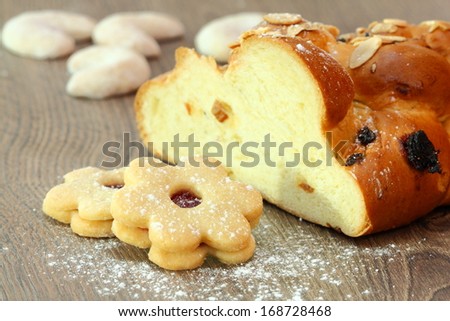 Christmas cake on brown wooden background with sweets